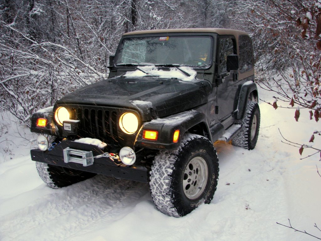 Black Jeep in the winter using the command start to heat